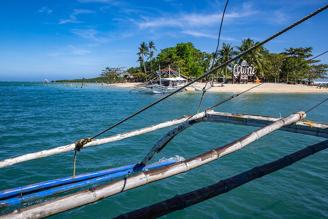  Cowrie Island seen from Bangka outrigger canoe tour boat, Honda Bay, near Puerto Princesa, Palawan, Philippines 