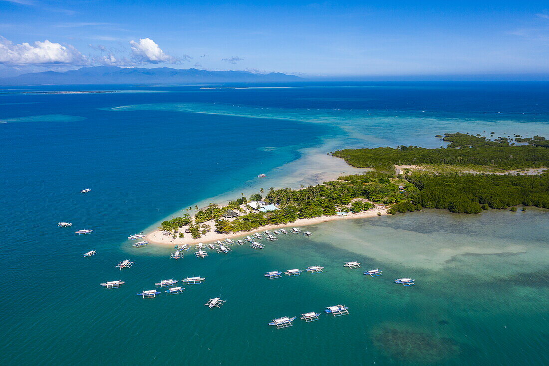  Aerial photographs of Bangka outrigger canoe tour boats on Cowrie Island, Honda Bay, near Puerto Princesa, Palawan, Philippines 