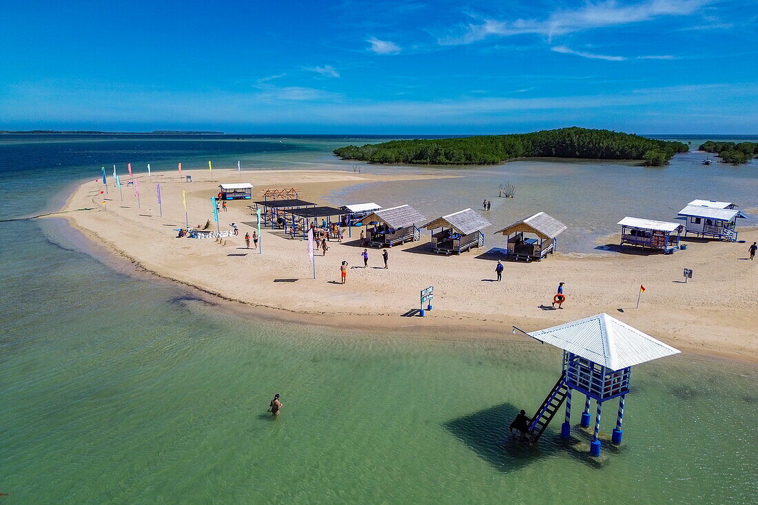  Aerial view of sandbar and people enjoying beach with huts at Luli Island, Honda Bay, near Puerto Princesa, Palawan, Philippines 