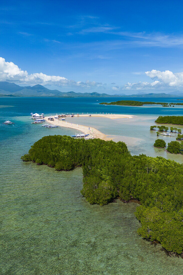  Aerial view of mangroves, sandbar and Bangka outrigger canoe tour boats on Luli Island, Honda Bay, near Puerto Princesa, Palawan, Philippines 