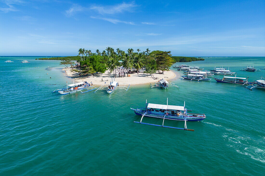  Aerial photographs of Bangka outrigger canoe tour boats on Cowrie Island, Honda Bay, near Puerto Princesa, Palawan, Philippines 