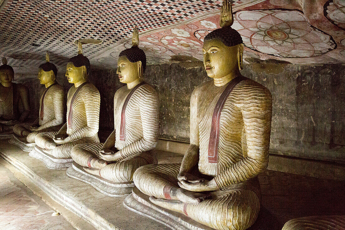 Buddha figures inside Dambulla cave Buddhist temple complex, Sri Lanka, Asia