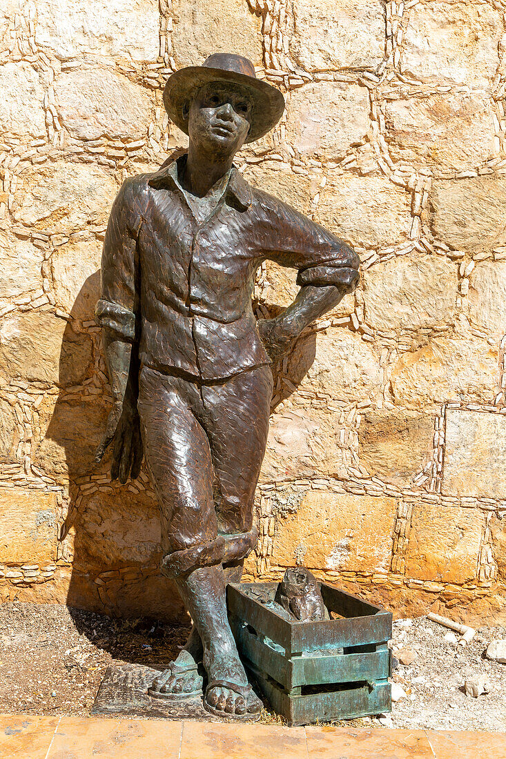 Bronze sculpture statue of a fisherman by city wall Campeche, Campeche State, Mexico