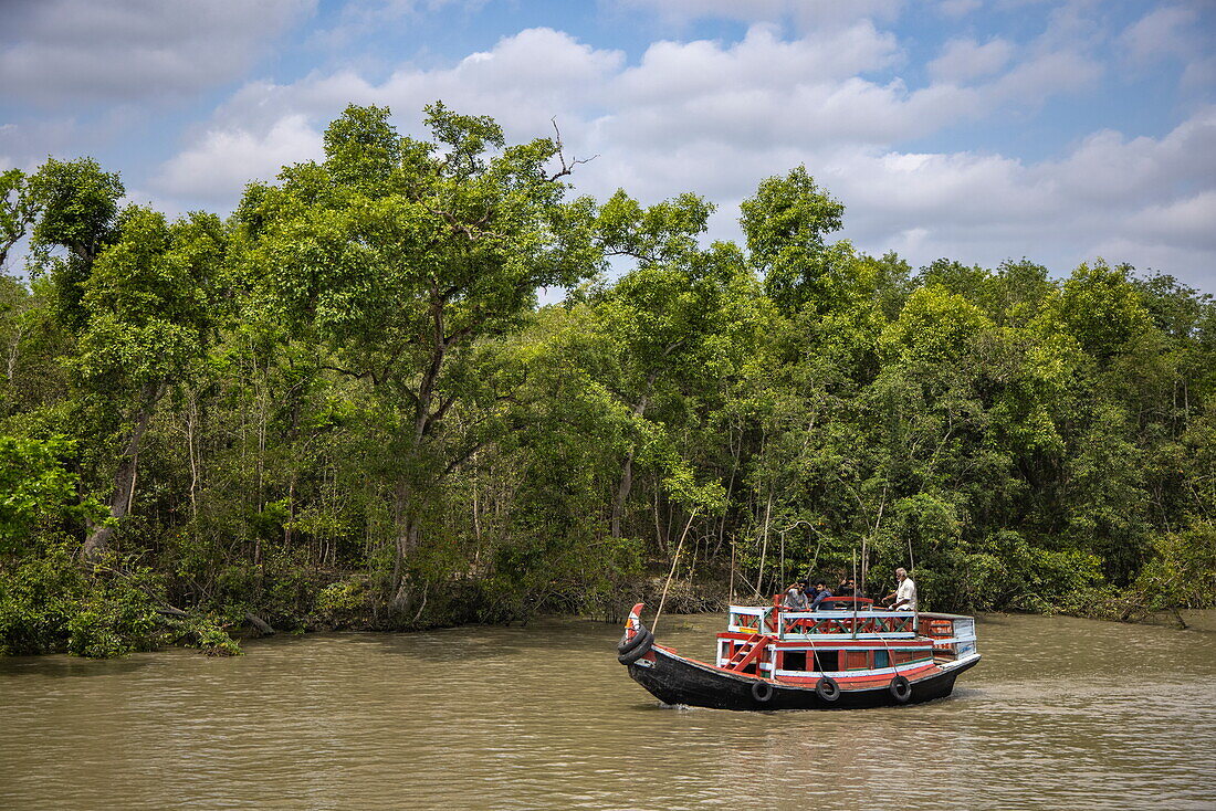  Men on a local tour boat along the Pashur River near Karamjal Forest Camp, near Mongla, Bagerhat District, Bangladesh, Asia 