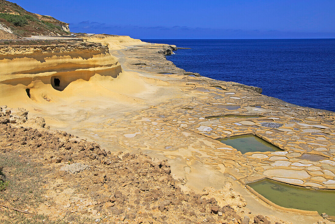 Historic ancient salt pans on coast near Marsalforn, island of Gozo, Malta