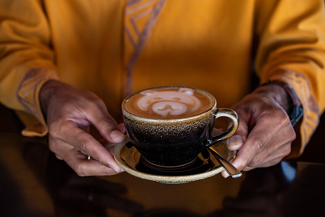  Cappuccino with teddy bear foam is served on board the river cruise ship The Jahan (Heritage Line) on the Mekong, near (Cai Be) Cái Bè, Tien Giang (Tiền Giang), Vietnam, Asia 