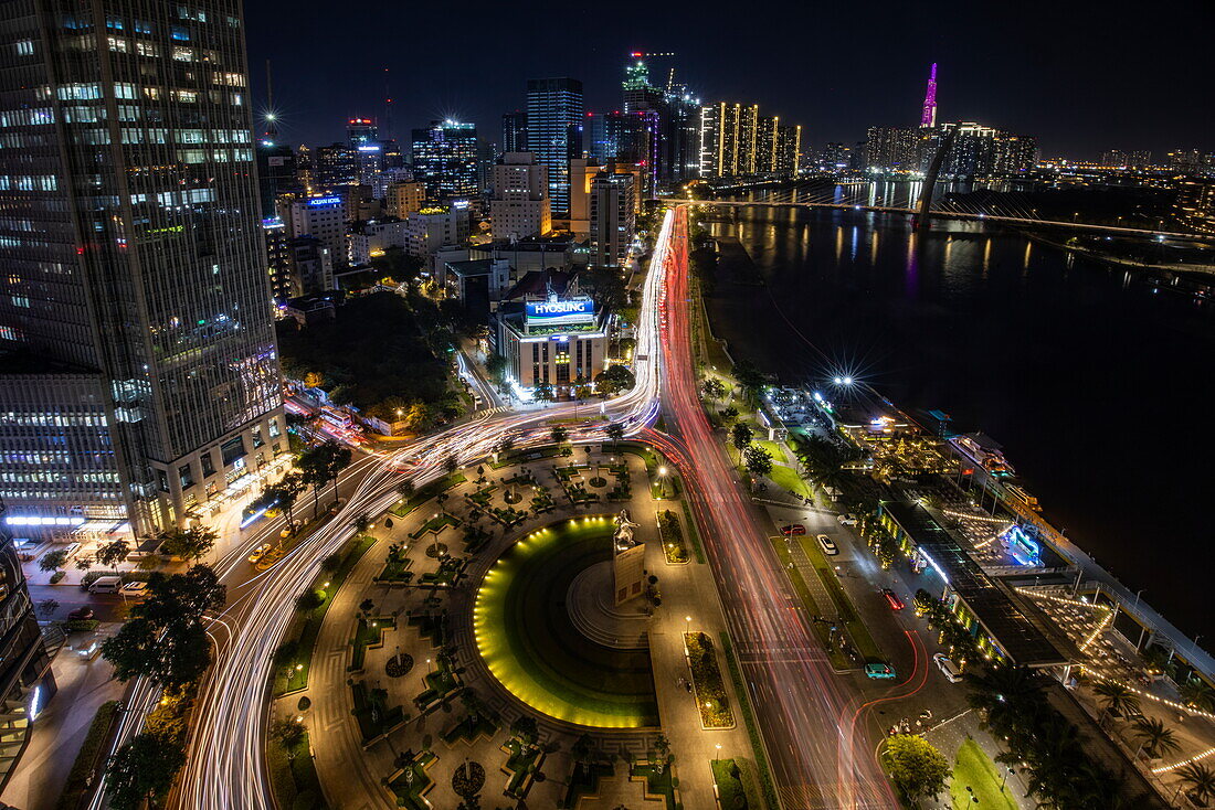  Long exposure of rush hour traffic and skyline from Liquid Sky Bar of Renaissance Riverside Hotel Saigon at night, Ho Chi Minh City (Saigon), Vietnam, Asia 