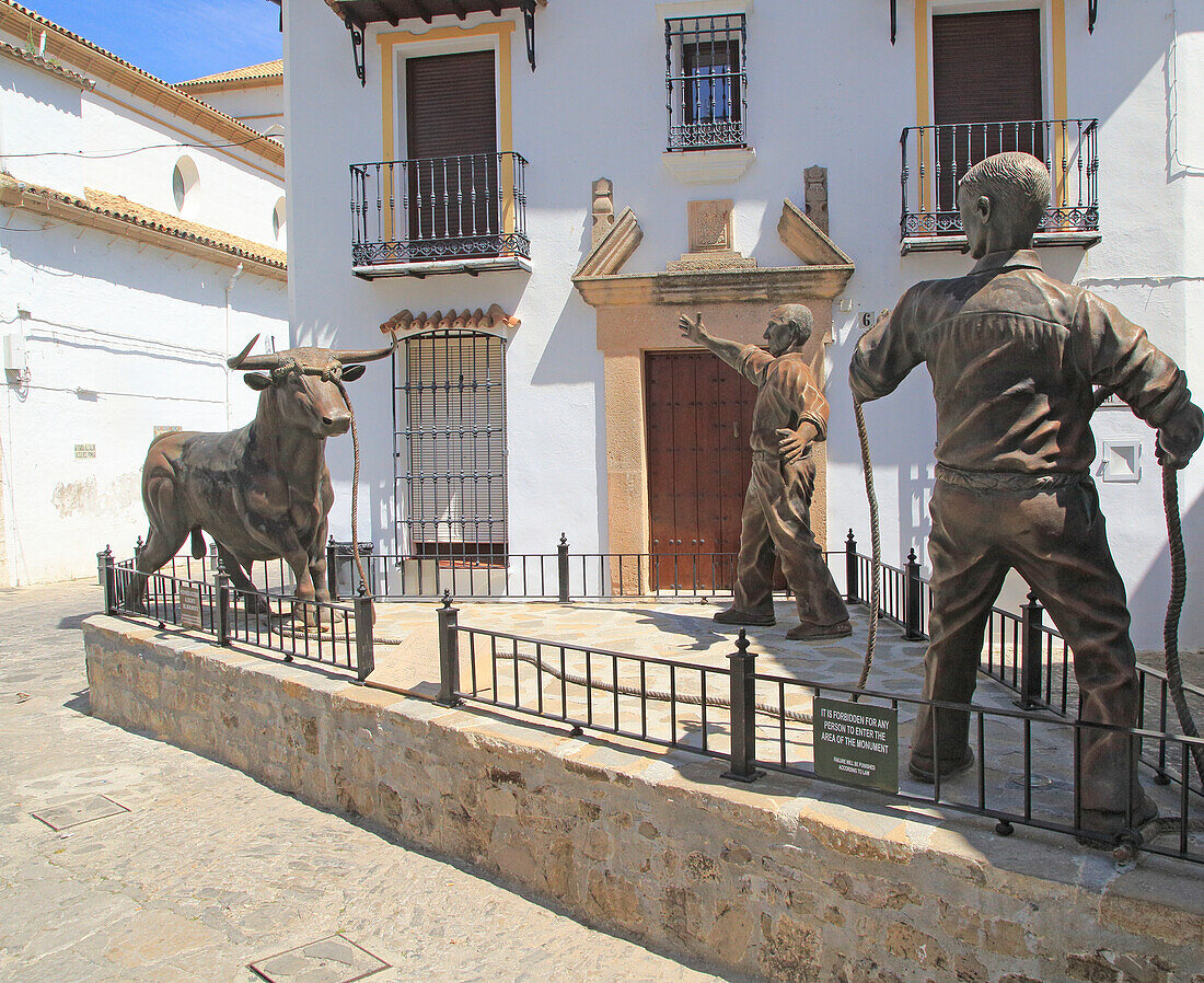 Sculpture of two men and bull, village of Grazalema, Cadiz province, Spain celebrating local farming traditions