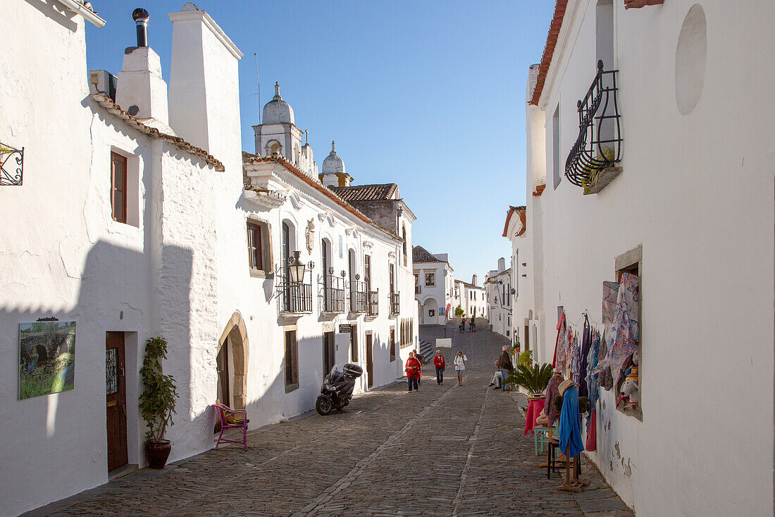 Historic cobbled street whitewashed buildings walled hilltop village of  Monsaraz, Alto Alentejo, Portugal, southern Europe