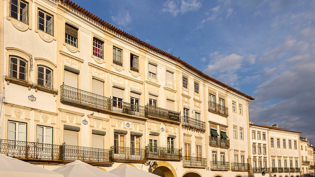 Historic buildings in famous city centre square in soft late afternoon light at dusk, Giraldo Square, Praça do Giraldo, Evora, Alto Alentejo, Portugal southern Europe