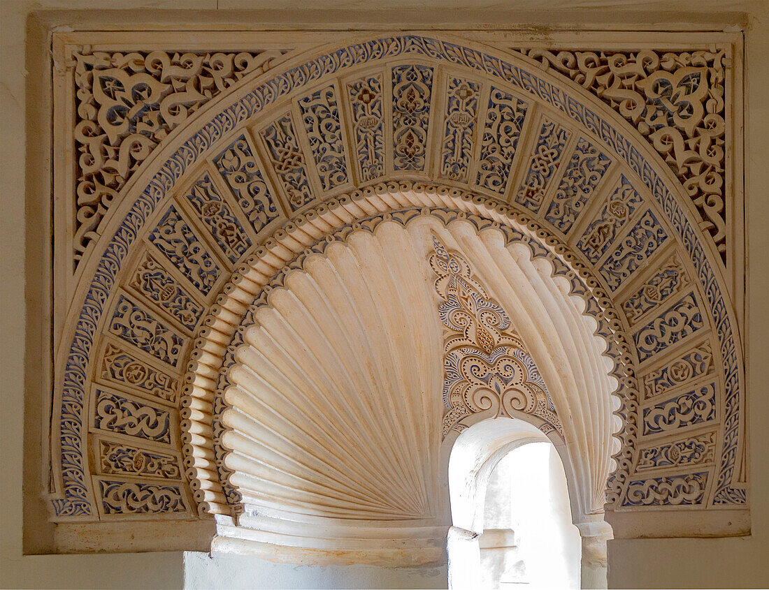 Islamic design architectural detail inside the Moorish palace of the Alcazaba, Malaga, Andalusia, Spain - decorated arches