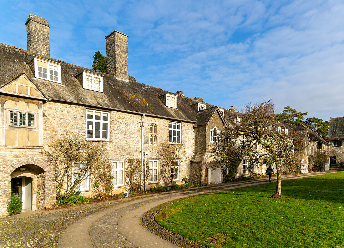 Historic medieval buildings in courtyard of Great Hall, Dartington Hall estate, south Devon, England, UK