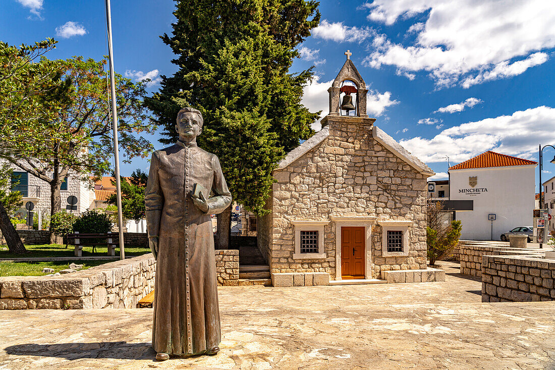  Statue in front of the church of Sv. Rok in Primosten, Croatia, Europe  