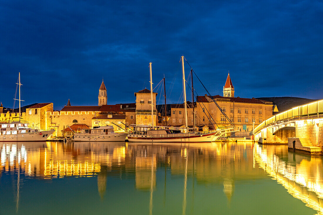  Cruise ships in front of the old town of Trogir at dusk, Croatia, Europe  