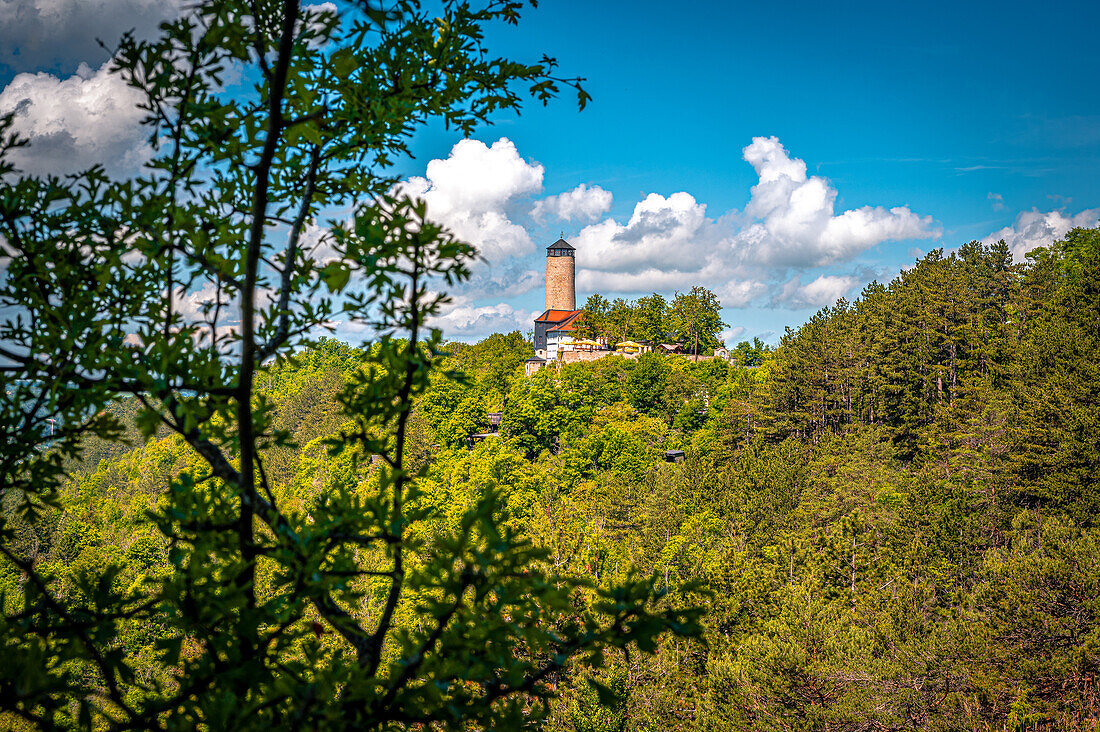  View of the Fuchsturm on the local mountain in Jena in summer with blue sky and white cumulus clouds, Jena, Thuringia, Germany 