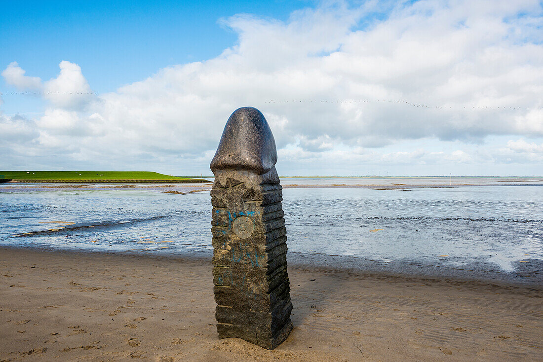  Stone sculpture on the beach and Wadden Sea, penis, artist Eckart Grenzer, Dangast, Jadebusen, North Sea, Lower Saxony, Germany 