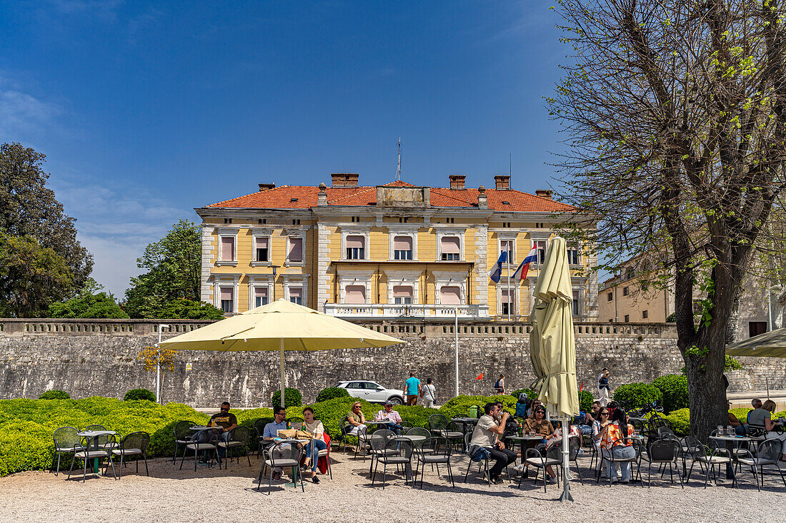  Cafe on the waterfront and government building in Zadar, Croatia, Europe 