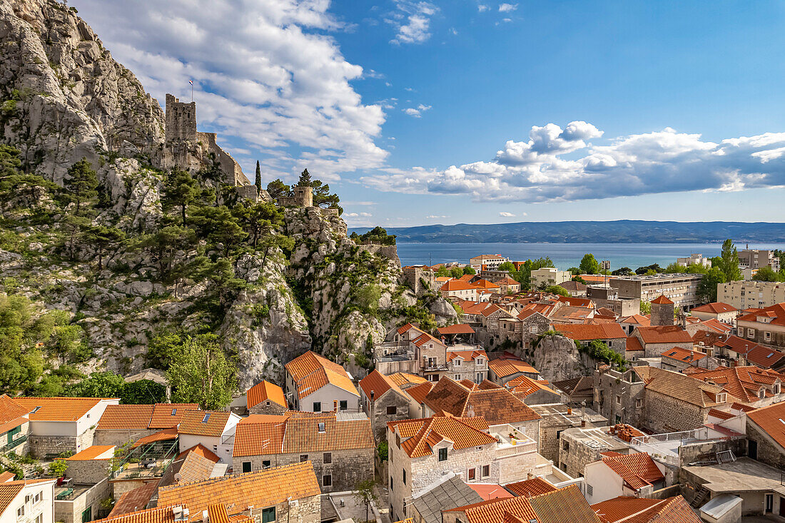  The old town of Omis with the ruins of the fortress Mirabella or Peovica seen from above, Croatia, Europe  