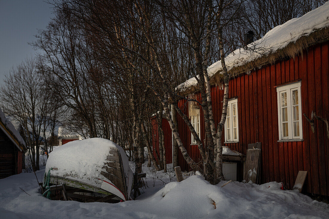  Traditional Norwegian house with boat in winter, Tromsø region. 