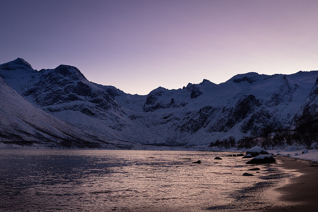  Winter in the Trömso region, Vagbotn bay with mountains in the twilight 