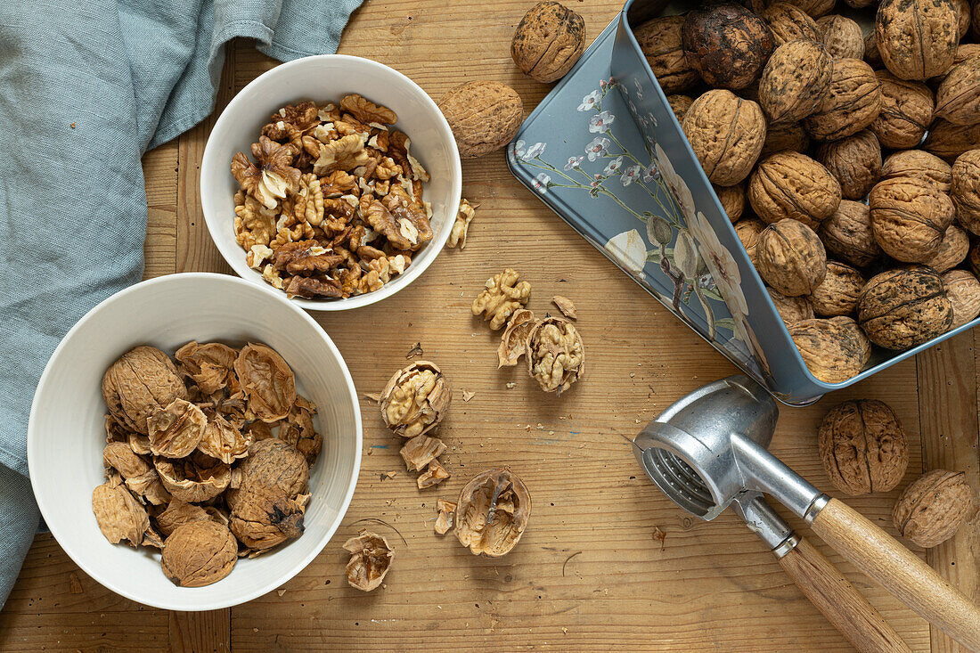  Open and closed walnuts with nutcracker  