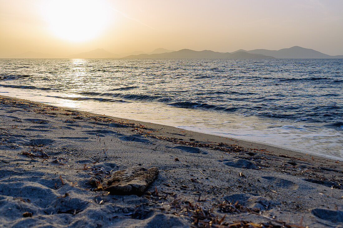  Sandy beach in Tigaki (Tingaki) just before sunset on the island of Kos in Greece with a view of the coast of Turkey 