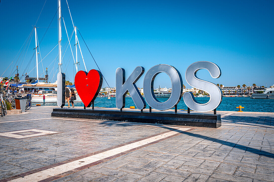  “I Love Kos” statue at the harbor of Kos Town on the island of Kos, Kos Town, Kos, Greece 