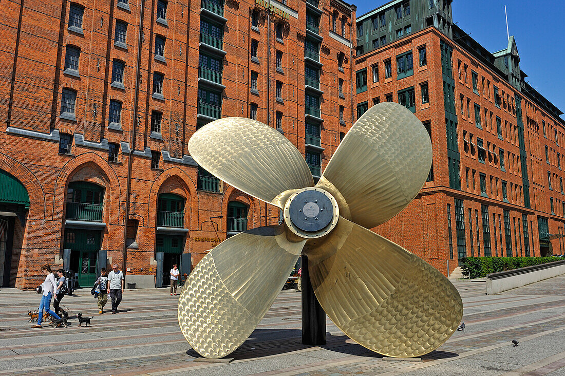 Propeller (by Wartsila, a Finnish corporation which manufactures and services power sources and other equipment in the marine and energy markets) on the promenade beside the Internationales Maritimes Museum Hamburg (IMMH) housed in a former warehouse, HafenCity quarter, Hamburg, Germany, Europe