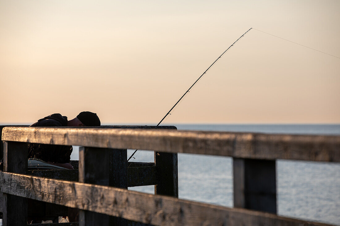  Fisherman on the pier in Wustrow, Wustrow, Baltic Sea, Fischland, Darß, Zingst, Vorpommern-Rügen district, Mecklenburg-Vorpommern, Western Pomerania region, Germany, Europe 