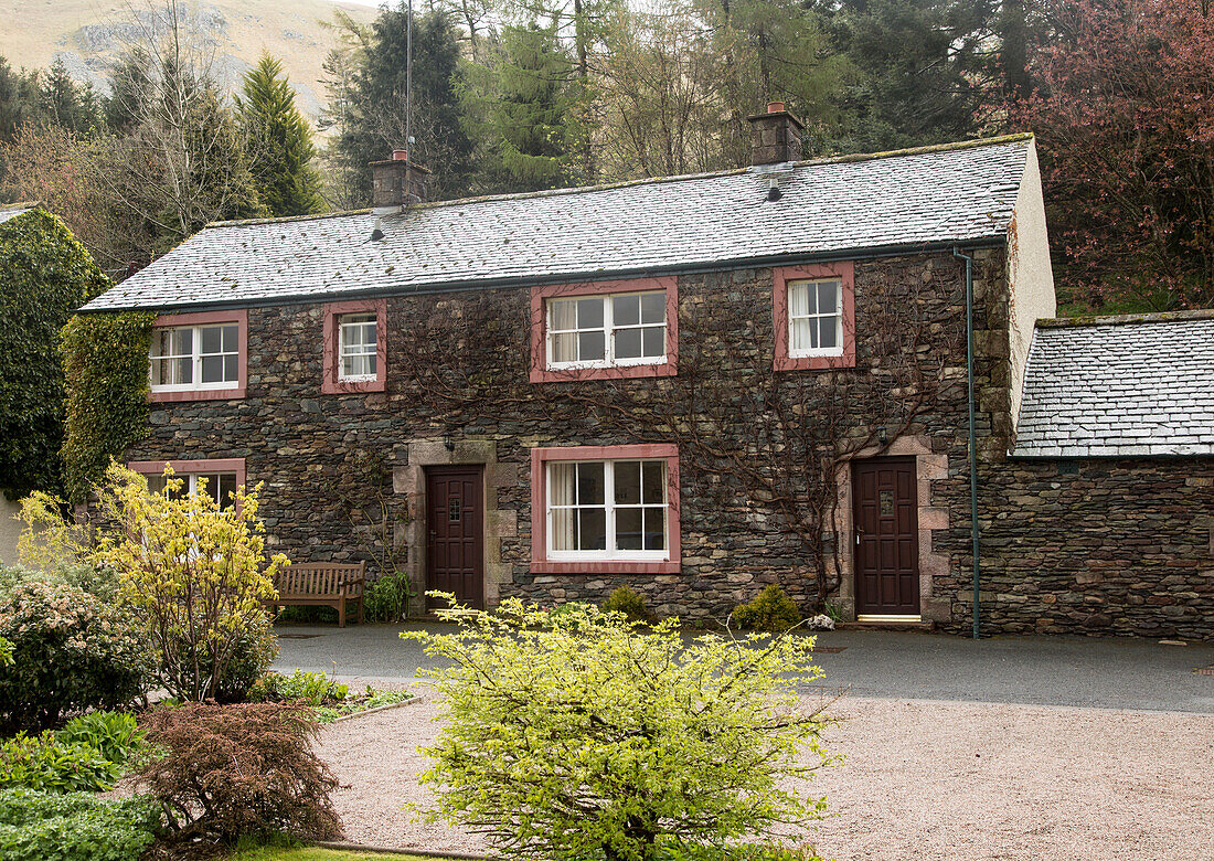 Traditional stone cottages at Howtown, Ullswater, Cumbria, England, UK