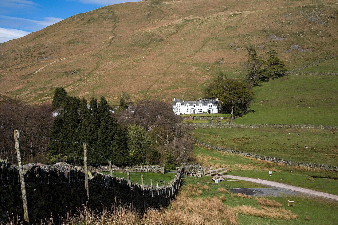 Traditional stone farmhouse at Howtown, Ullswater, Cumbria, England, UK