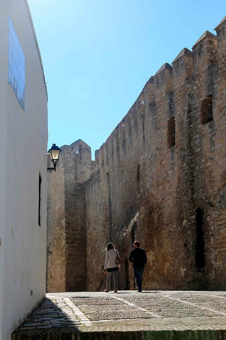 Historic street and castle walls in the village of Vejer de la Frontera, Cadiz Province, Spain