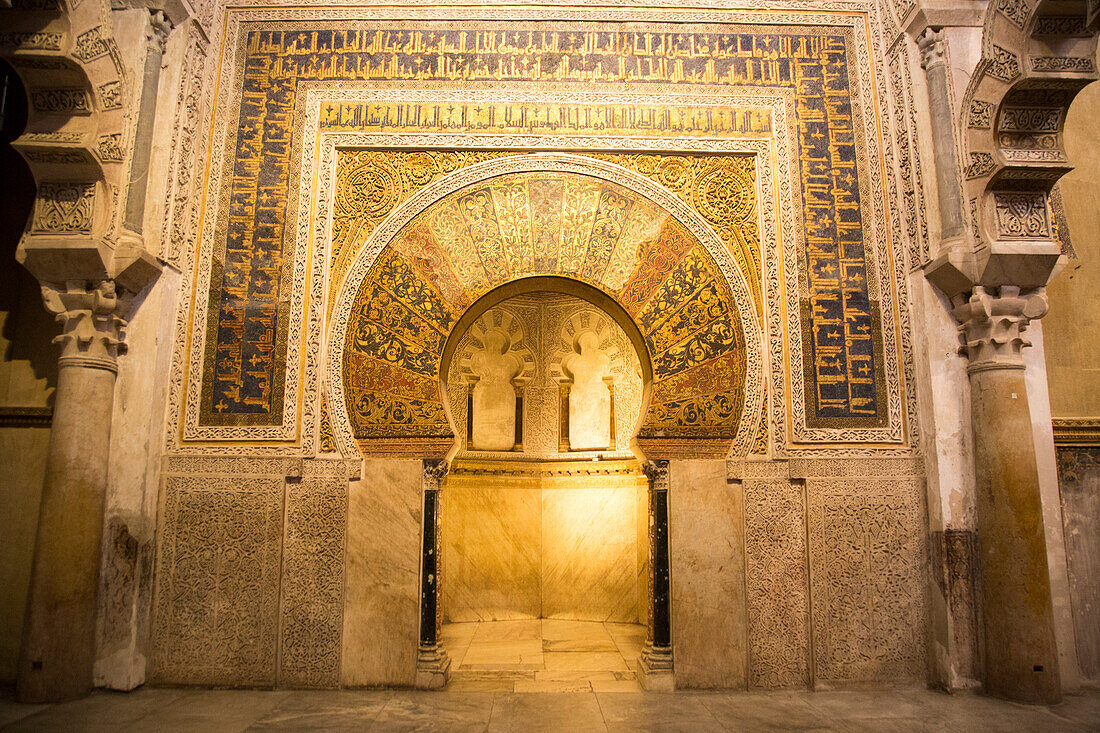 Richly inscribed stonework of keyhole shaped Mihrab, the centrepiece of the Great Mosque, Cordoba, Spain