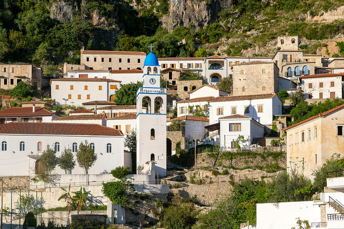 View of village of Dhermi, Albania whitewashed buildings on mountainside