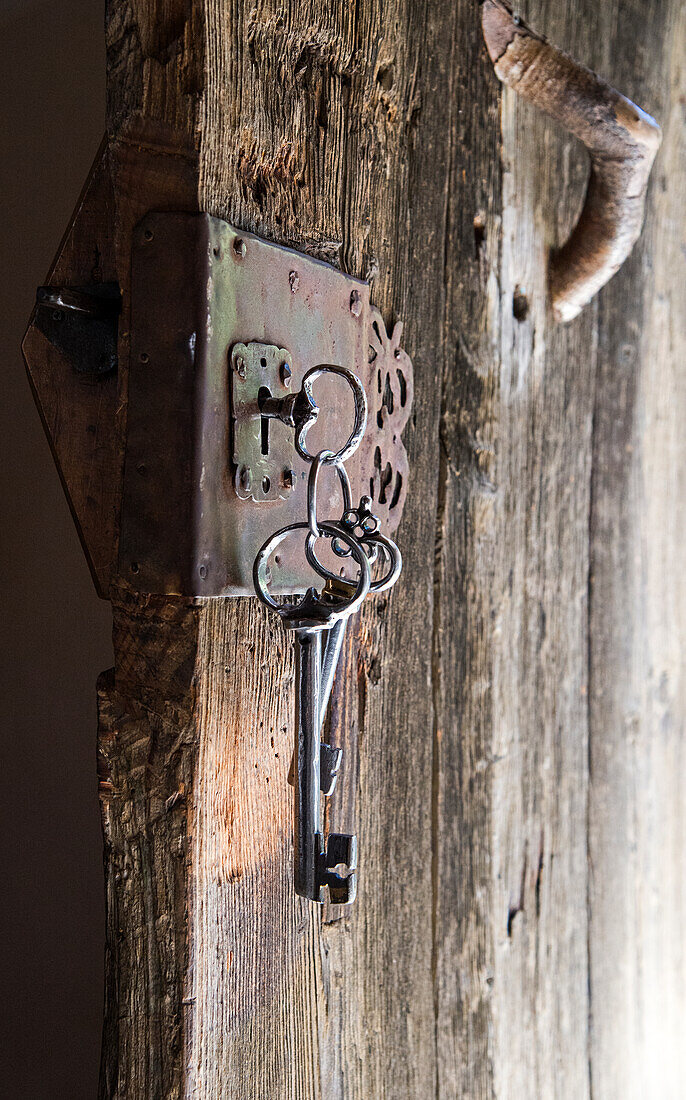  Wooden door with old keys, keyring, South Tyrol 