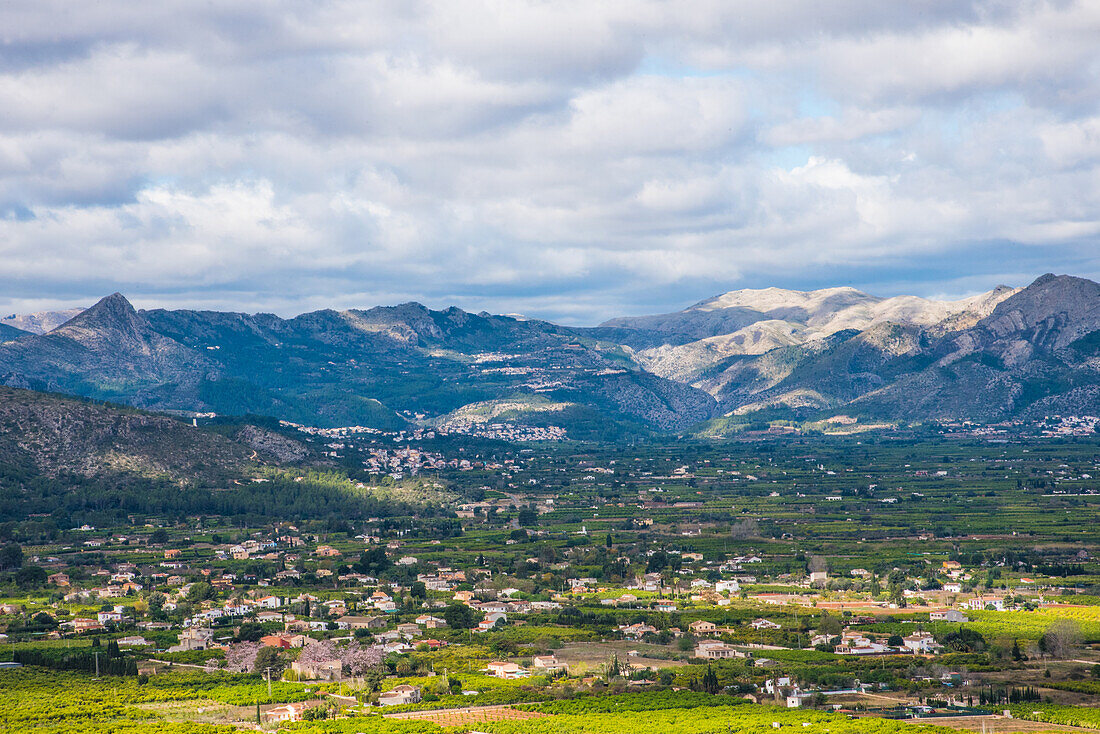  Coastal mountains of the province of Valencia with Spain&#39;s largest orange plantations in the foreground, Spain 