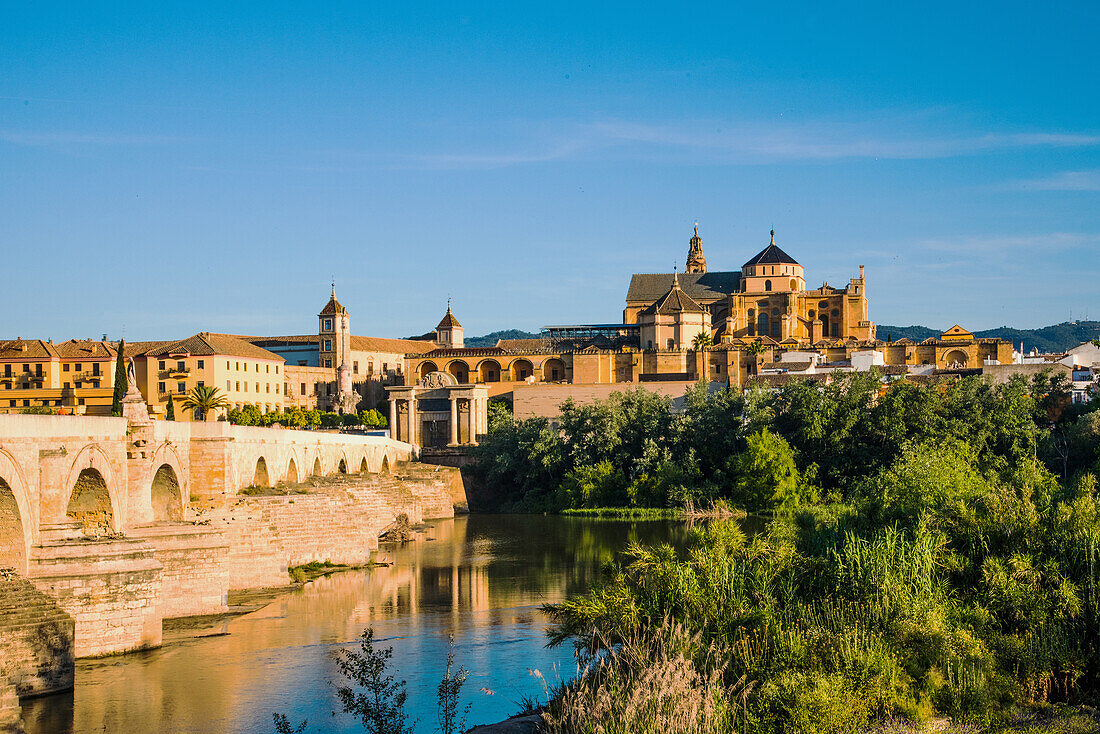  Cordoba, Roman bridge, 2000 years old, over the Guadalquivir, early morning, with Mesquita in the background, Cordoba province, Spain 