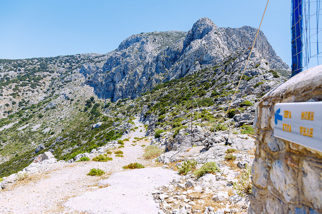  Hiking trail to the monastery of Panagìa Psilí in the rocks high above the village of Metóchi on the island of Kalymnos (Kalimnos) in Greece 