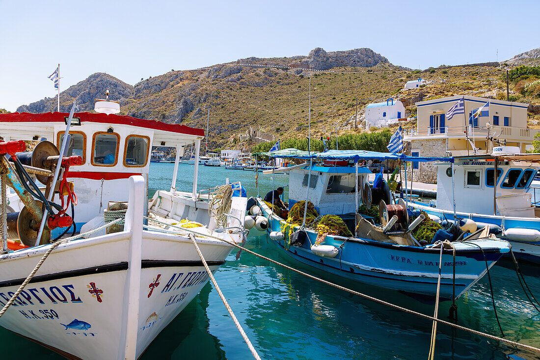  Harbor bay of Vathí with fishing boats and view of early Christian chapels on the island of Kalymnos (Kalimnos) in Greece 