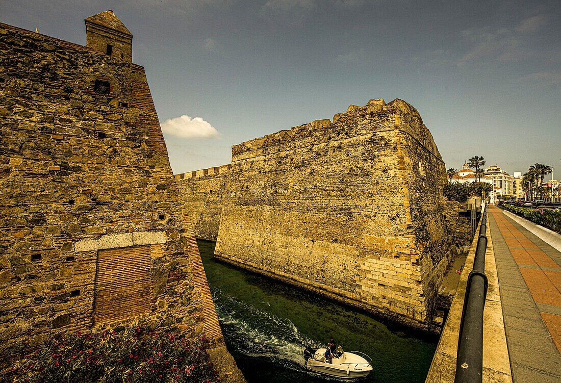  Murallas Reales, the royal walls with moat, seen from the sea promenade, in the background the city centre of Ceuta with the cathedral, North African coast, Spain 