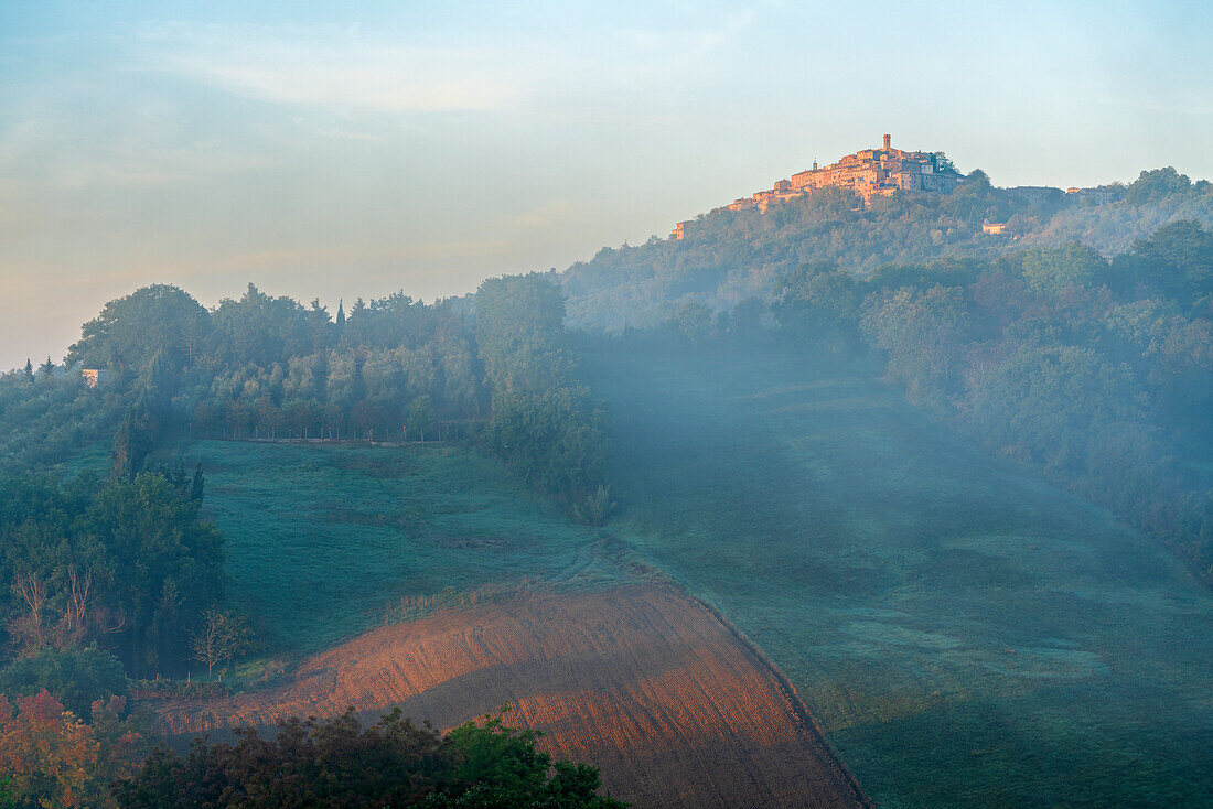  Chiusdino in the morning mist, Tuscany, Italy 