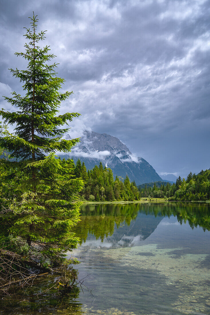  Thunderstorm atmosphere in the Karwendel at the Isar reservoir near Krün, Bavaria, Germany 