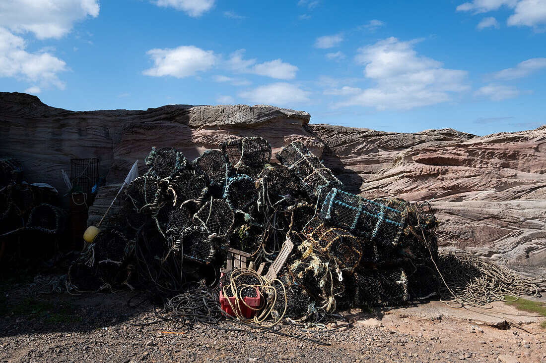  View of lobster pots in a small harbour, East Lothian, Scotland, United Kingdom 