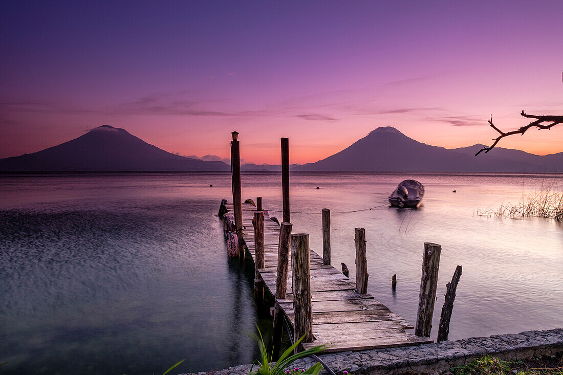 Traditional moorings and volcanoes of Atitlan 3537 m. and San Pedro 3020 m. Lake Atitlan, Sololá Department, Republic of Guatemala, Central America