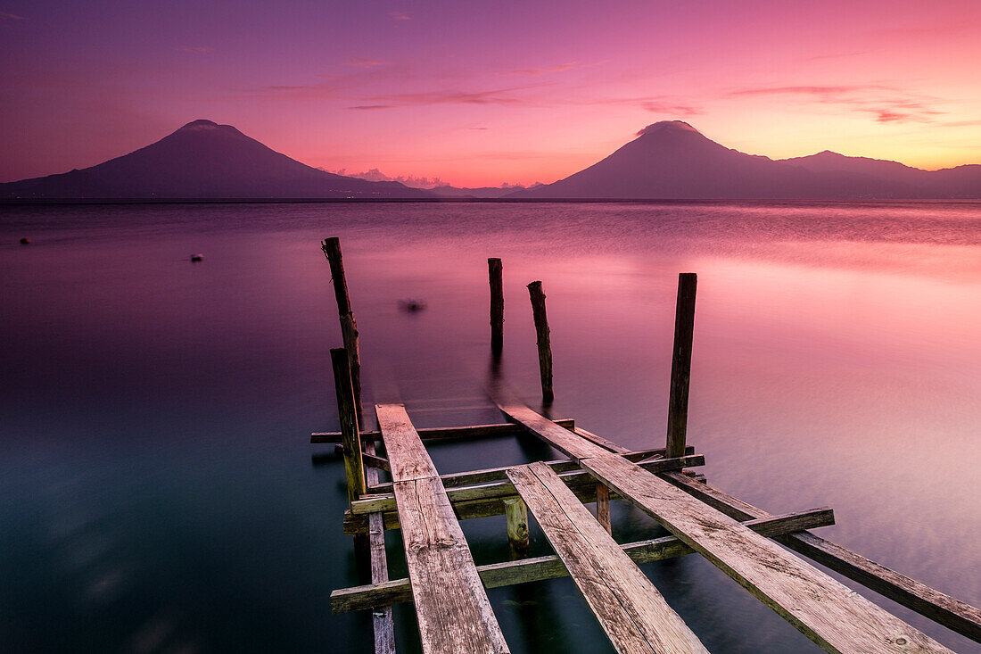 Traditional moorings and volcanoes of Atitlan 3537 m. and San Pedro 3020 m. Lake Atitlan, Sololá Department, Republic of Guatemala, Central America