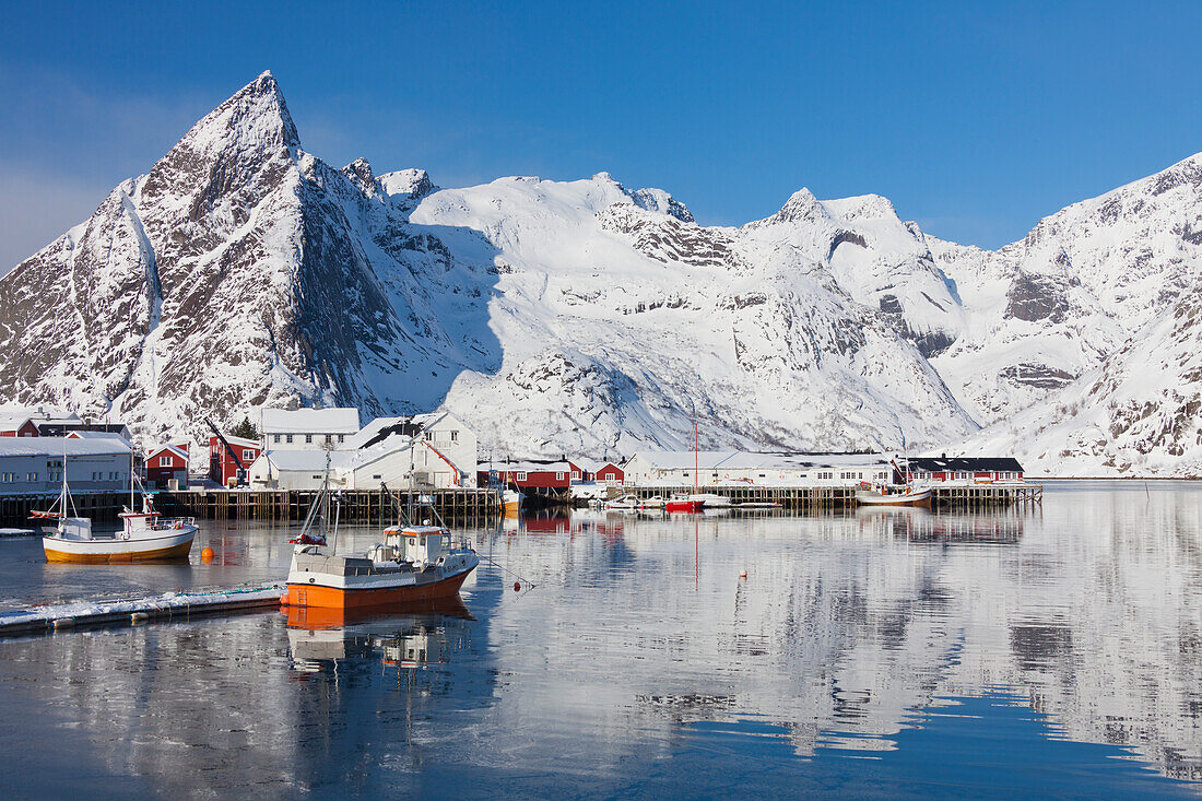  Fishing boat in the harbor of Hamnoy, winter, Lofoten, Norway 