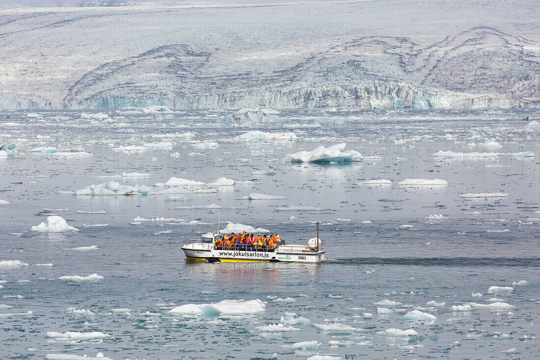  Amphibious vehicle with tourists in glacier lake Joekusarlon, summer, Iceland 