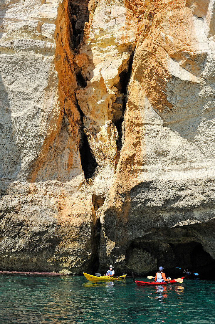 kayak at the entrance of a cave inside the cliff near Cala Galdana, South Coast of Cala Galdana, Menorca, Balearic Islands, Spain, Europe