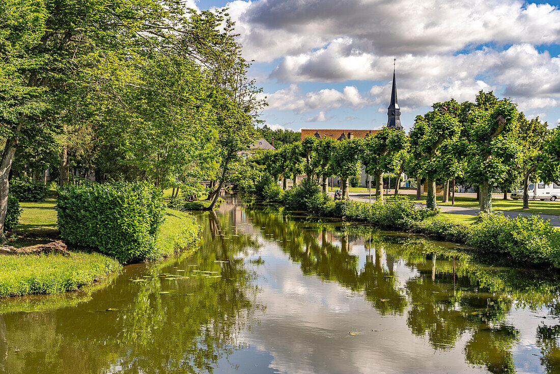  The Loir river and Notre-Dame church in Alluyes, Centre-Val de Loire, France, Europe 