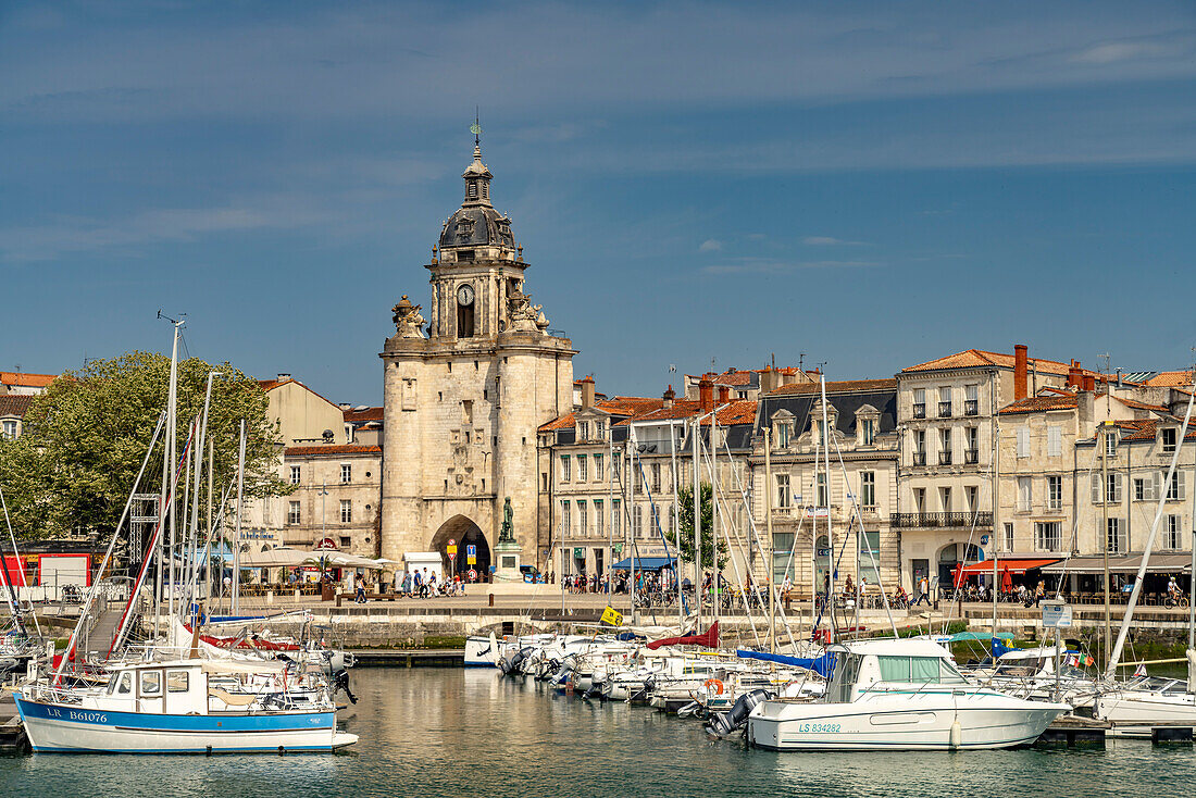  Harbor, clock tower Porte de la Grosse Horloge and the old town in La Rochelle, France, Europe 